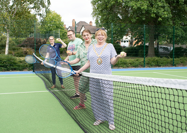 (front to back) The Mayor of Rugby, Cllr Barbara Brown, Cllr Maggie O'Rourke, Rugby Borough Council portfolio holder for partnerships and wellbeing, Cllr Richard Harrington, who represents the Benn Ward, and Anna Hart, the LTA's delivery manager, at the refurbished tennis courts in Caldecott Park.